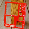 US SAH-6R red gravelometer, a flat metal plate with square sizing openings and stamped scale markings